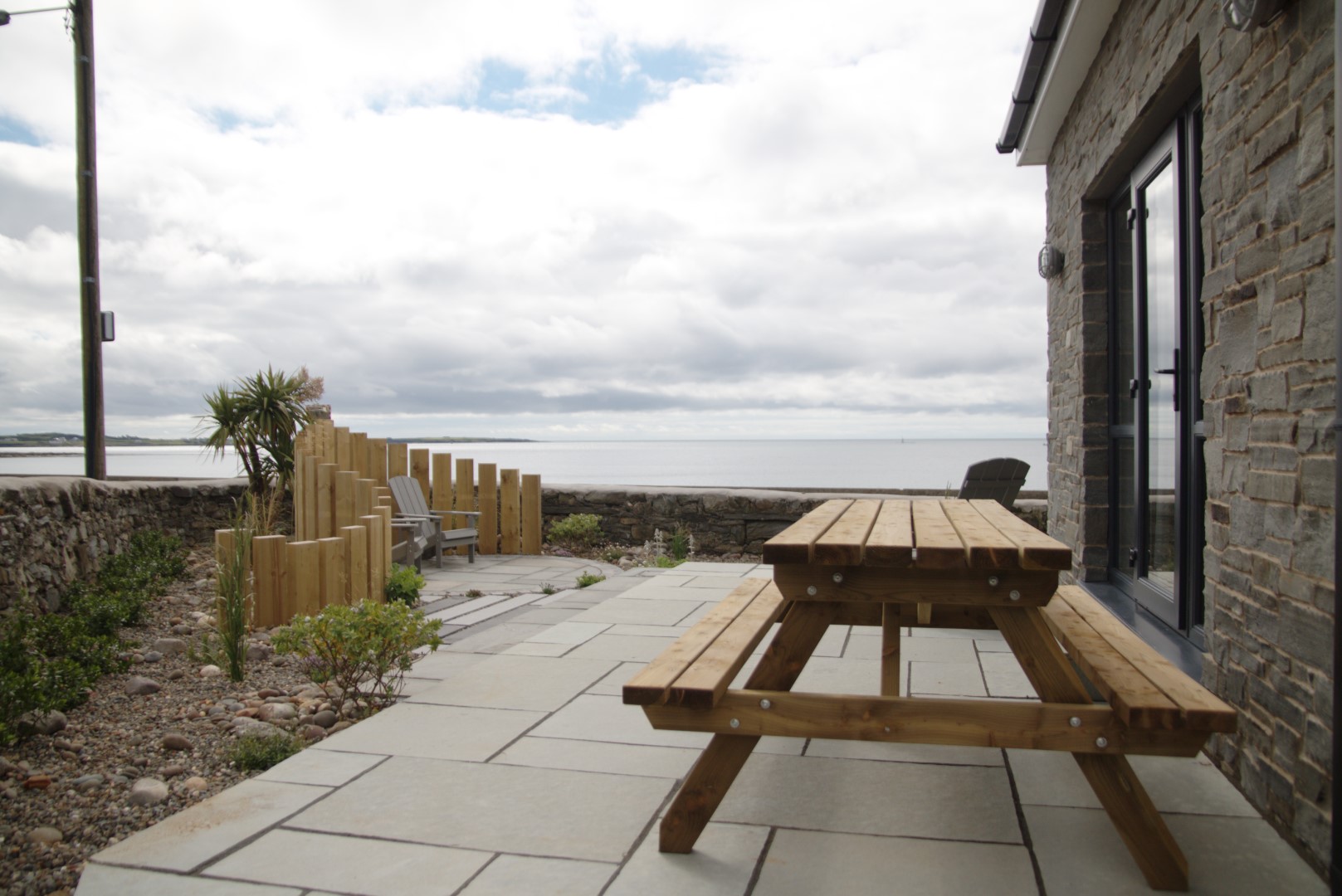 Coastal garden patio and bench